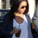 Actress Mila Kunis and boyfriend Ashton Kutcher cozy up with coffee as they refuel at Starbucks