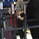 **EXCLUSIVE** Jessica Biel seen at LAX Airport as she waits in a line with her luggage