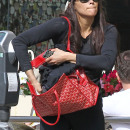 **EXCLUSIVE** Paula Patton covers her belly with a purse as she feeds the parking meter before heading into the gym