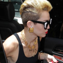 Miley Cyrus arrives at the Y100 Mack-A-Poolooza pool party in Miami with her mom and 13 year old sister Noah