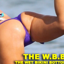Claudia Romani paddleboarding in a thong bikini in Miami