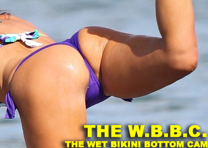 Claudia Romani paddleboarding in a thong bikini in Miami