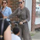 Exclusive - Katy Perry Takes A Break From Her Bike Ride in The Hamptons
