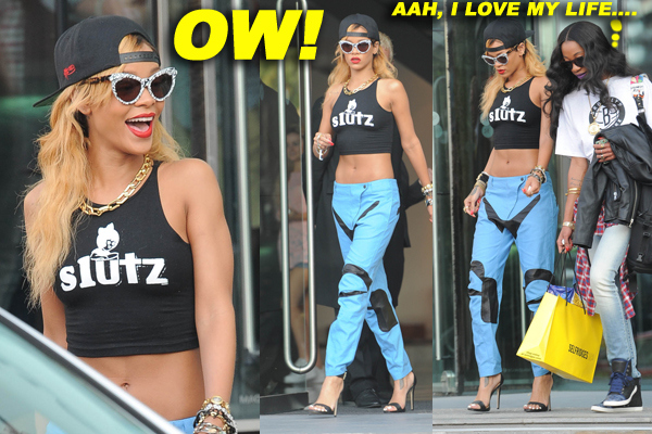 Rihanna makes a statement with a black 'slutz' crop-top as she heads out of her Manchester hotel