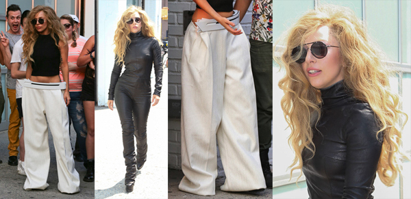 Lady Gaga bares her midriff in a black crop top and baggy white pants as she heads out of a photo studio in New York City