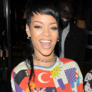 WORLDLY WOMAN! Rihanna is all smiles as she steps out of her London hotel wearing a flags of the world outfit