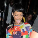 WORLDLY WOMAN! Rihanna is all smiles as she steps out of her London hotel wearing a flags of the world outfit