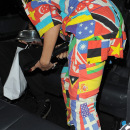 Rihanna leaving her hotel, wearing a jumpsuit made up of pictures of the world's national flags