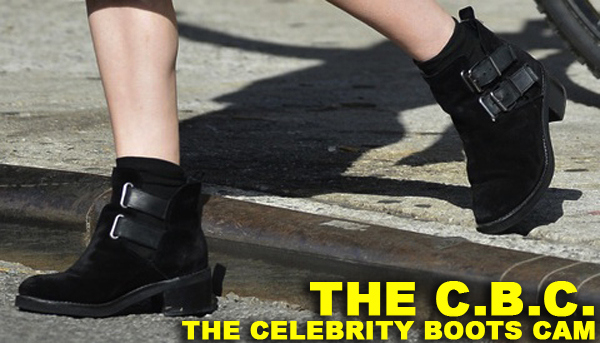 Rose McGowan, wearing a black dress with matching black boots, goes out and about in SoHo, NYC
