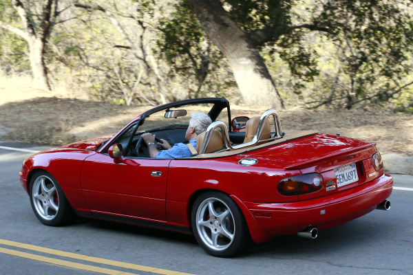 **EXCLUSIVE** Jay Leno drives a red supercharged Mazda Miata convertible while filming scenes for a commercial in LA