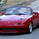 **EXCLUSIVE** Jay Leno drives a red supercharged Mazda Miata convertible while filming scenes for a commercial in LA