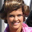 **EXCLUSIVE** NOT VERY MODEL-LIKE! Nina Agdal appears to be digging around in her bathing suit bottoms as she arrives on the set of 'Entourage' with her hair in rollers and wearing a fluffy pink robe