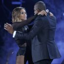 Beyonce and her husband Jay-Z perform at the 56th annual Grammy Awards in Los Angeles