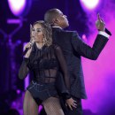 Beyonce and her husband Jay-Z perform at the 56th annual Grammy Awards in Los Angeles