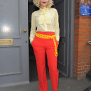 Rita Ora leaving a recording studio, wearing bright red trousers
