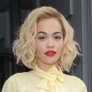 Rita Ora leaving a recording studio, wearing bright red trousers