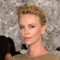 PARIS: Charlize Theron Brings Along Sean Penn To The Christian Dior Fashion Show
