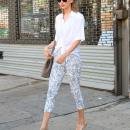 Taylor Swift Steps Out In A White Blouse & Cropped Leggings