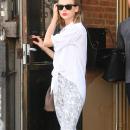 Taylor Swift Steps Out In A White Blouse & Cropped Leggings