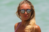 Bikini-Clad Laura Cremaschi Helps Elderly Man At The Beach!