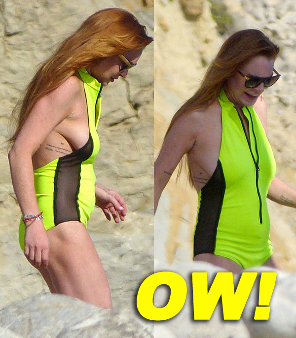 Lindsay Lohan puts safety first as she wears a lifejacket while riding jet skis in Ibiza